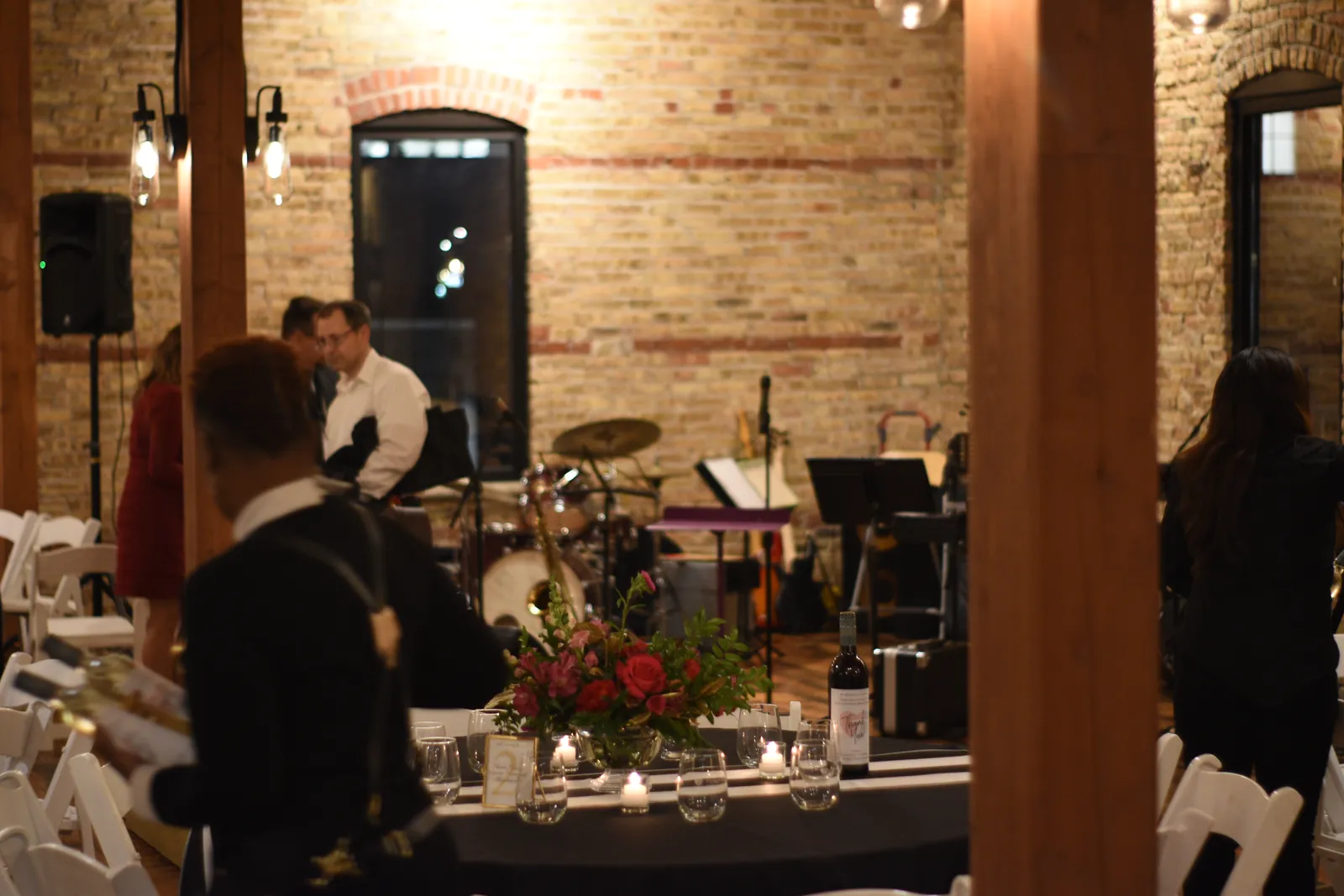 A live band and bar service in a brick event venue