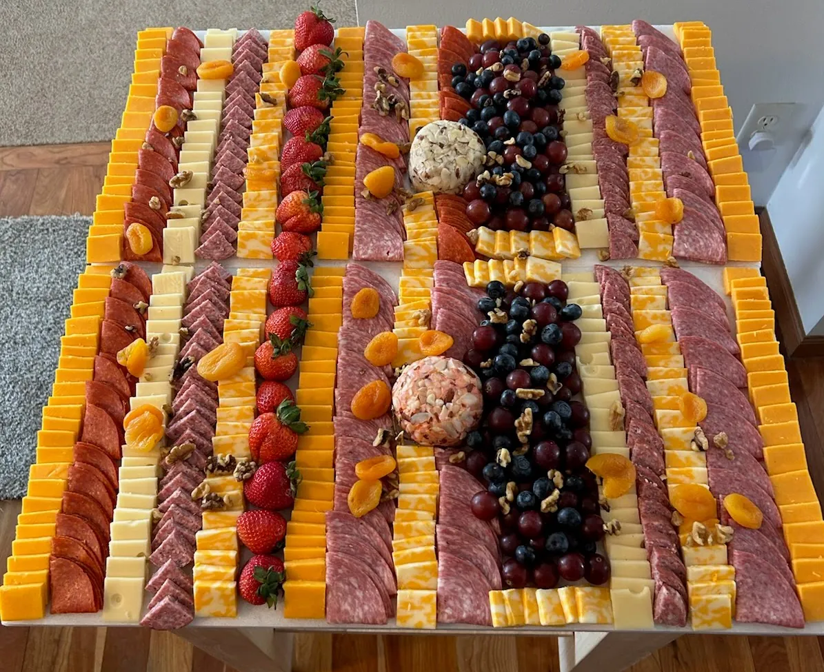 An extra-large charcuterie slate of meats, cheeses and fruit