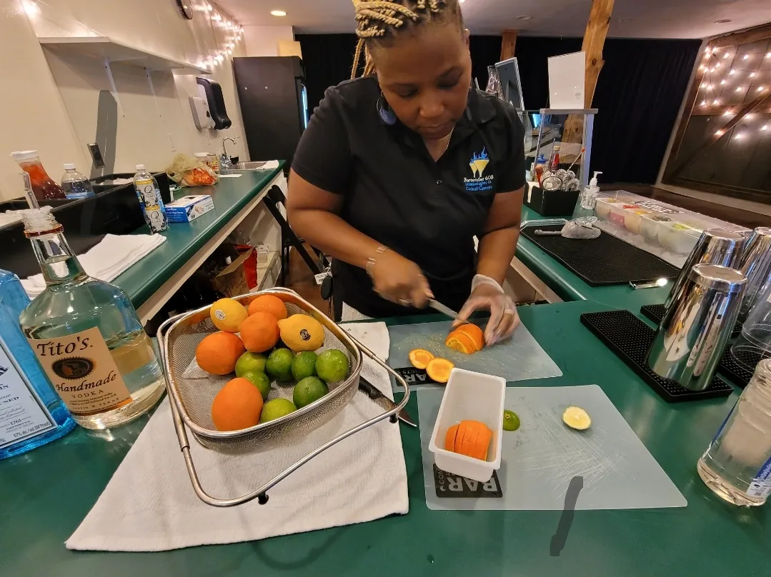 China Moon preparing citrus garnishes behind the bar